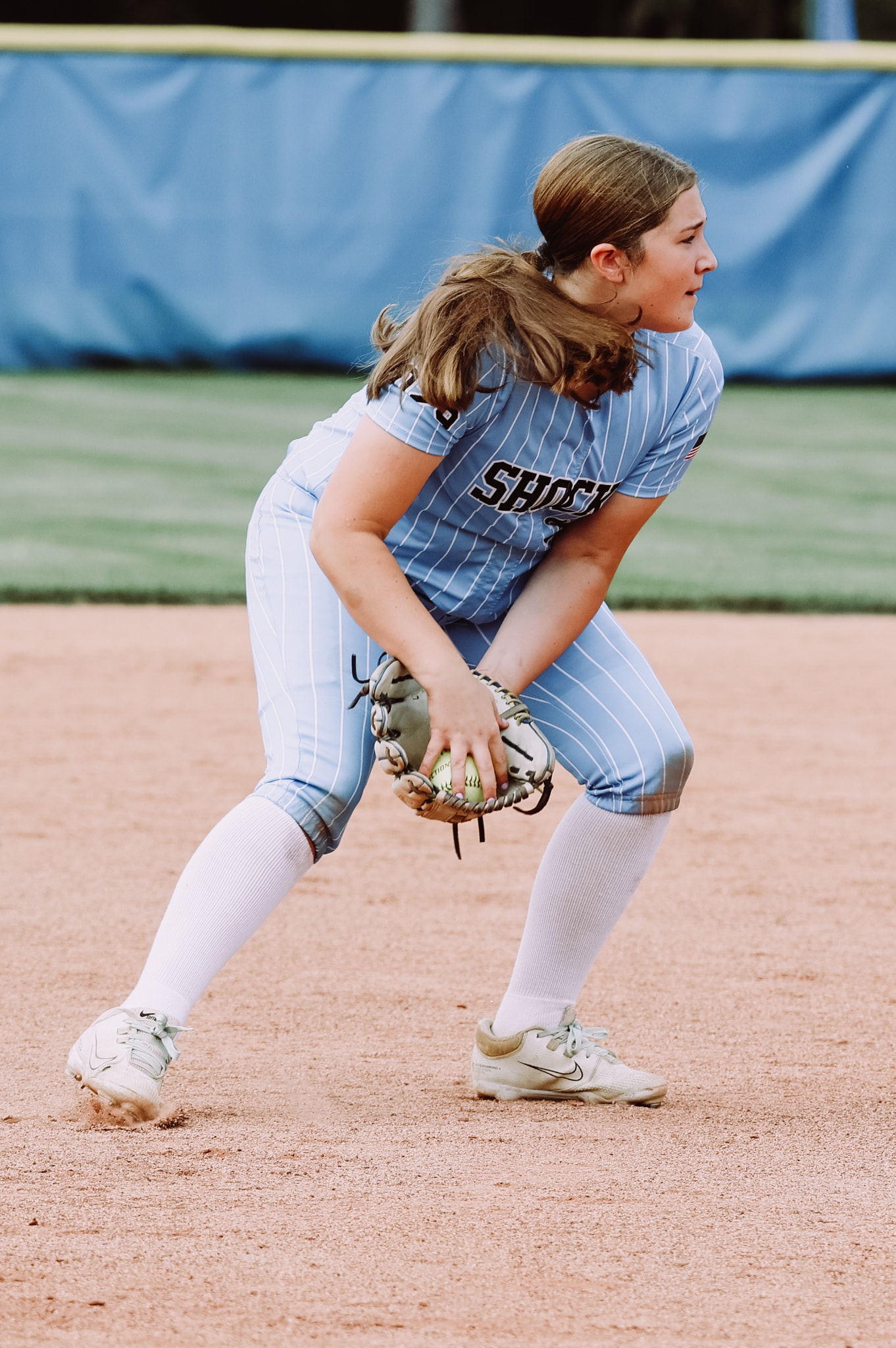 Youth softball player batting during practice